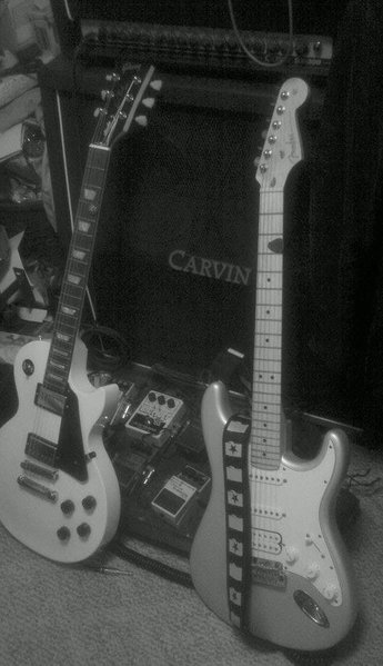 My Gibson Les Paul Studio and my Fender American Standard Strat (SSH). Their names are Domino and Ophelia, respectively.