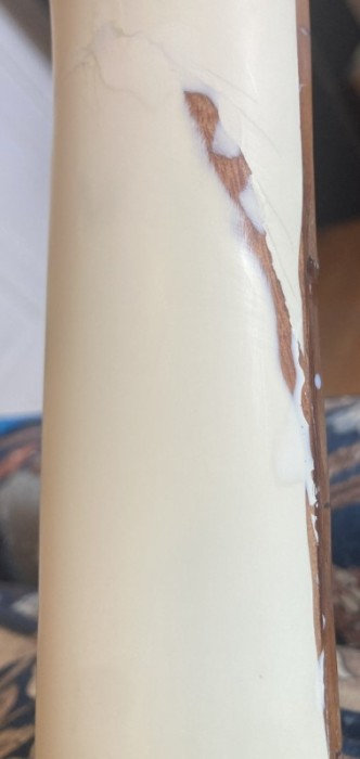 here you can see the filled area along the edge of the fingerboard which is darker than the rosewood.