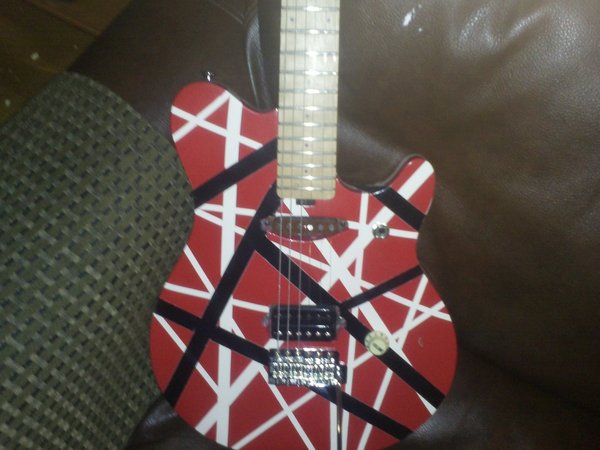 OLP with the obvious paint job and an attackbucker and replicator in the neck, switch is moved and it has a wilkenson trem